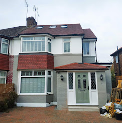 Exterior render and brickwork on a semi-detached home extension