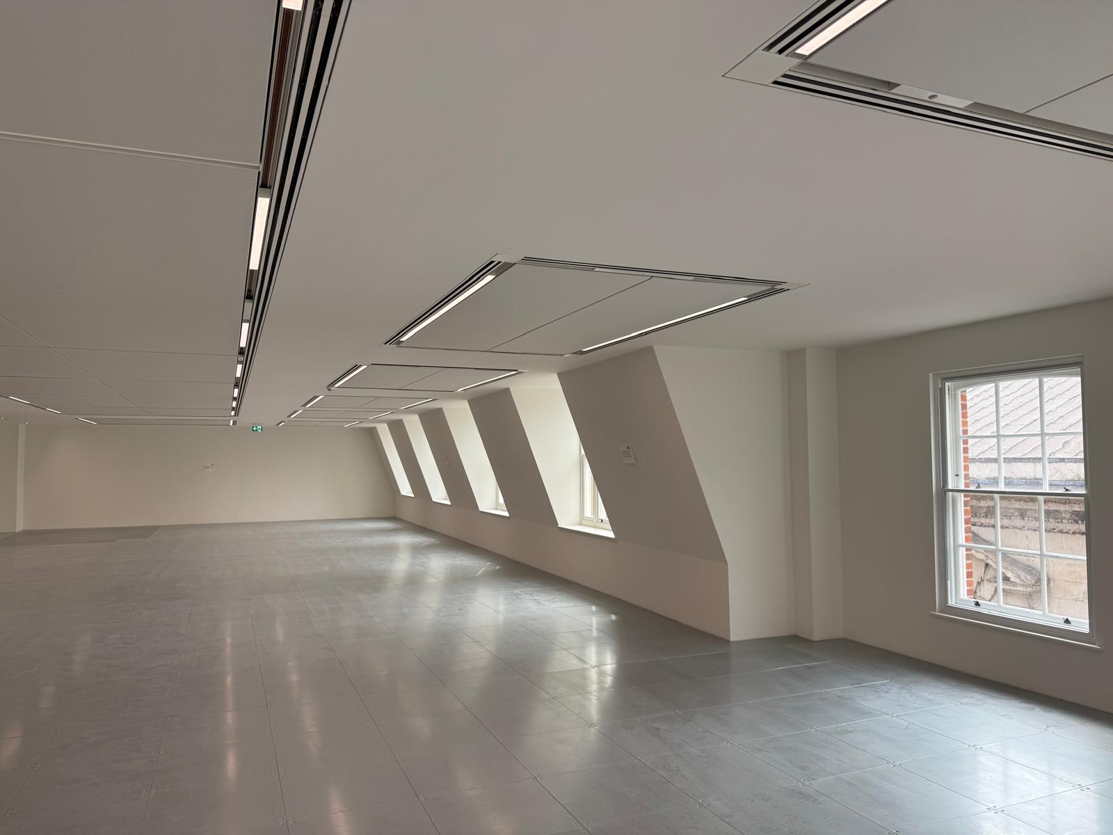 Bright white office floor with restored windows